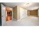 Spacious basement with carpet, built-in closets, and access to other rooms at 2057 Chambord Way, Snellville, GA 30078