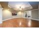 Finished basement with large TV and hardwood floors at 2057 Chambord Way, Snellville, GA 30078