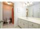 Bright bathroom with orange shower curtain and white vanity at 2057 Chambord Way, Snellville, GA 30078