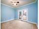 Light and airy bedroom with neutral walls and carpeting at 2057 Chambord Way, Snellville, GA 30078