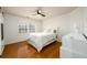 Bright bedroom with hardwood floors and white built-ins at 2057 Chambord Way, Snellville, GA 30078