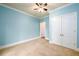 Spacious bedroom with light blue walls and carpeting at 2057 Chambord Way, Snellville, GA 30078