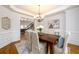 Elegant dining room with hardwood floors, crown molding, and a chandelier at 2057 Chambord Way, Snellville, GA 30078