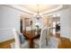 Elegant dining room featuring a spacious table and hardwood floors at 2057 Chambord Way, Snellville, GA 30078