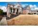 Brick home with a walkway and landscaping at 2057 Chambord Way, Snellville, GA 30078