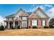 Two-story home with a brick and siding exterior at 2057 Chambord Way, Snellville, GA 30078