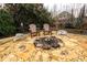 Stone fire pit surrounded by comfortable seating at 2057 Chambord Way, Snellville, GA 30078