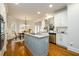 Modern kitchen with white cabinets, a large island, and stainless steel appliances at 2057 Chambord Way, Snellville, GA 30078