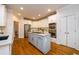 Modern kitchen with white cabinets, a large island, and stainless steel appliances at 2057 Chambord Way, Snellville, GA 30078