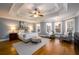 Spacious main bedroom with hardwood floors, tray ceiling, and ample natural light at 2057 Chambord Way, Snellville, GA 30078