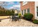 Charming brick patio with a table and four chairs at 2057 Chambord Way, Snellville, GA 30078