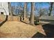 Large backyard with mature trees and wooden fence at 2590 Knox Ne St, Atlanta, GA 30317