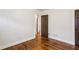 Well-lit bedroom featuring hardwood floors and a door at 2590 Knox Ne St, Atlanta, GA 30317