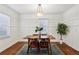 Dining room with hardwood floors, wood table, and wainscoting at 2590 Knox Ne St, Atlanta, GA 30317