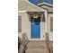 Blue front door with glass panels and stone steps at 2590 Knox Ne St, Atlanta, GA 30317