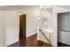 Upstairs hallway with hardwood floors and access to bedrooms at 2590 Knox Ne St, Atlanta, GA 30317