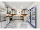 Modern kitchen with stainless steel appliances and blue doors to deck at 2590 Knox Ne St, Atlanta, GA 30317