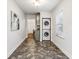 Laundry room with stackable washer and dryer, and view of dining area at 2590 Knox Ne St, Atlanta, GA 30317