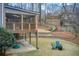 Elevated deck with screened porch overlooking landscaped yard at 9385 N Lake Dr, Roswell, GA 30076