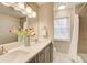 Bathroom with double vanity and updated fixtures at 9385 N Lake Dr, Roswell, GA 30076