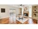 Breakfast nook with hardwood floors, a fireplace, and built-in shelving at 9385 N Lake Dr, Roswell, GA 30076