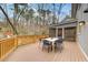 Spacious deck with wooded backdrop, perfect for outdoor dining at 9385 N Lake Dr, Roswell, GA 30076