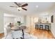 Open concept dining area with hardwood floors and kitchen views at 9385 N Lake Dr, Roswell, GA 30076