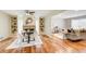 Bright dining area with hardwood floors and built-in shelving at 9385 N Lake Dr, Roswell, GA 30076