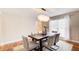 Modern dining room with hardwood floors and a chandelier at 9385 N Lake Dr, Roswell, GA 30076