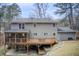 Gray sided two story house with deck and landscaped yard at 9385 N Lake Dr, Roswell, GA 30076