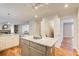 Modern kitchen with island and hardwood floors at 9385 N Lake Dr, Roswell, GA 30076