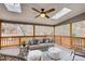 Relaxing screened porch with wooden deck and comfortable seating at 9385 N Lake Dr, Roswell, GA 30076