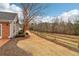 Private backyard with wood fence and mature trees at 1003 Somerton Pl, Cumming, GA 30040