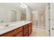 Double vanity bathroom with large shower and mirror at 1003 Somerton Pl, Cumming, GA 30040