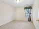 Simple bedroom with neutral walls, carpet, and window with curtains at 1003 Somerton Pl, Cumming, GA 30040