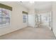 Bedroom with carpet floors and access to sunroom at 1003 Somerton Pl, Cumming, GA 30040