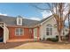 Brick and siding exterior with patio and landscaping at 1003 Somerton Pl, Cumming, GA 30040