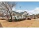 House exterior with landscaping and a tree in front at 1003 Somerton Pl, Cumming, GA 30040