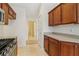 Kitchen with stainless steel appliances and wood cabinets at 1003 Somerton Pl, Cumming, GA 30040