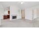 Living room with fireplace and built-in shelving at 1003 Somerton Pl, Cumming, GA 30040