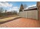 Private patio with tile flooring and wooden fence at 1003 Somerton Pl, Cumming, GA 30040