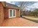 Brick patio with french doors leading to backyard at 1003 Somerton Pl, Cumming, GA 30040