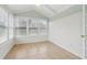 Sunroom with tile floors and multiple windows offering natural light at 1003 Somerton Pl, Cumming, GA 30040