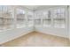 Bright sunroom featuring tile floors and abundant natural light at 1003 Somerton Pl, Cumming, GA 30040