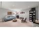 Finished basement with a comfortable sitting area and bookcase at 1418 Defoors Nw Dr, Atlanta, GA 30318