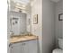 Small bathroom with granite countertop and white cabinets at 1418 Defoors Nw Dr, Atlanta, GA 30318