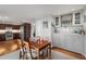 Bright dining room features built-in cabinetry and hardwood floors at 1418 Defoors Nw Dr, Atlanta, GA 30318