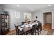 Bright dining room featuring hardwood floors and a large table at 1418 Defoors Nw Dr, Atlanta, GA 30318