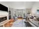 Living room with hardwood floors, fireplace, and bay window at 1418 Defoors Nw Dr, Atlanta, GA 30318