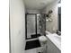 Modern bathroom with a large shower and white vanity at 1887 Plainsboro Dr, Lithonia, GA 30058